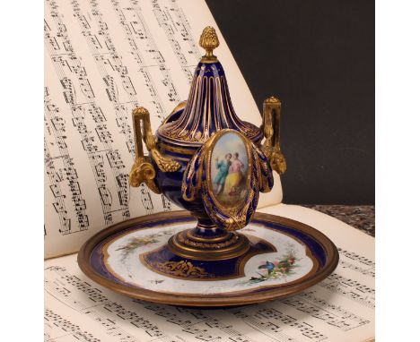A 19th century Continental gilt metal mounted porcelain inkwell, in the manner of Sèvres, decorated with courting couples, bi