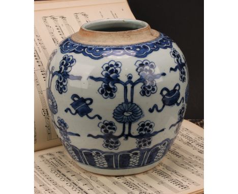 A Chinese porcelain ginger jar, painted in tones of underglaze blue with lotus blooms and characters depicting the Eight Prec