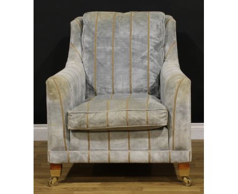 A Duresta Trafalgar armchair, stuffed-over upholstery, squab cushion, brass forecasters, 96cm high, 85cm wide, the seat 54cm 