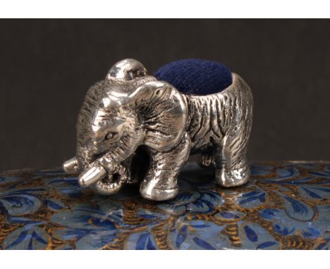 A silver novelty pin cushion, as an elephant, marked STERLING, 4cm long 