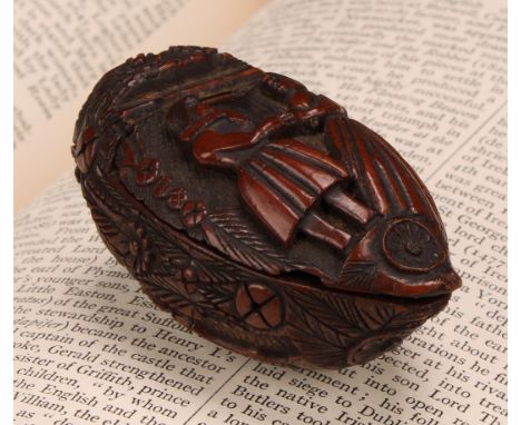 Snuff - a 19th century coquilla nut bugbear snuff box, carved with floral roundels and urns planted with flowering shrubs, th