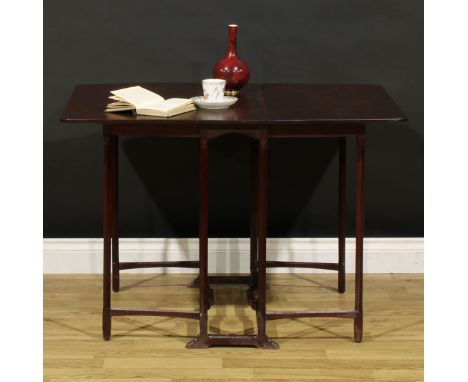 An Arts &amp; Crafts period mahogany spider-leg Sutherland table, fall leaves, square legs, sledge base, 67.5cm high, 22.5cm 