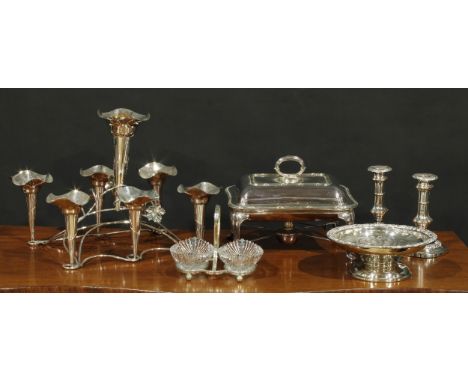 An EPNS seven-flute table centre epergne, formed of scrolling vine, 39cm wide; a rounded rectangular warming dish; candlestic