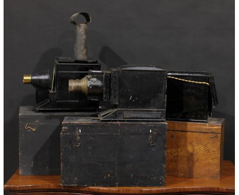 Photography - an early 20th century brass and black painted magic lantern, cased; two others; an interesting archive of slide