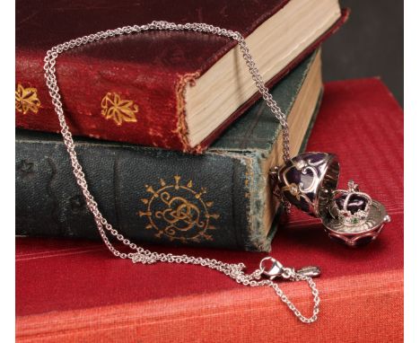 A Fabergé Heritage 18k white gold, diamond and purple guilloche enamel Queen jubilee surprise egg shaped locket, enclosing a 