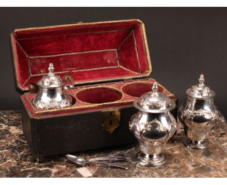 A set of three George II Old Sheffield Plate ogee pedestal tea caddies, each chased in the rococo taste with cartouches, swag