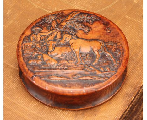 Snuff - A 19th century circular pressed walnut snuff box, the cover decorated with a farmer, cattle and sheep, 8cm in diamete