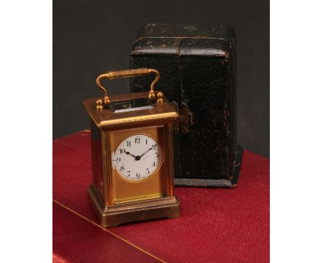 An early 20th century French gilt brass miniature carriage timepiece, 3.5cm clock dial inscribed with Arabic numerals, keyles