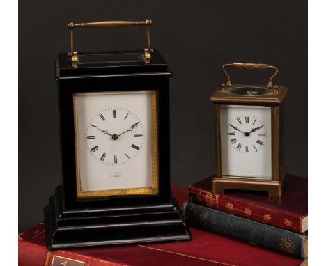 A French ebonised carriage type mantel timepiece, late 19th century, four-glass case with brass swing carrying handle, Roman 
