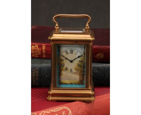 A French style porcelain mounted gilt brass miniature carriage timepiece, 3cm clock dial inscribed with Roman numerals, key-w