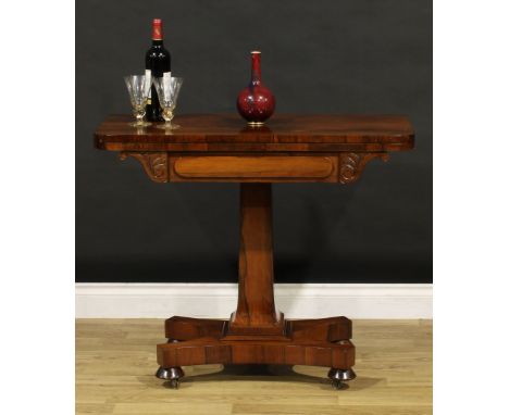 A George IV rosewood card table, hinged top enclosing a baize lined playing surface, spreading square column, moulded socle, 
