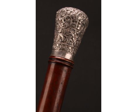 A 19th century Indian silver coloured metal mounted staff or walking stick, domed pommel chased with scrolling foliage, bambo