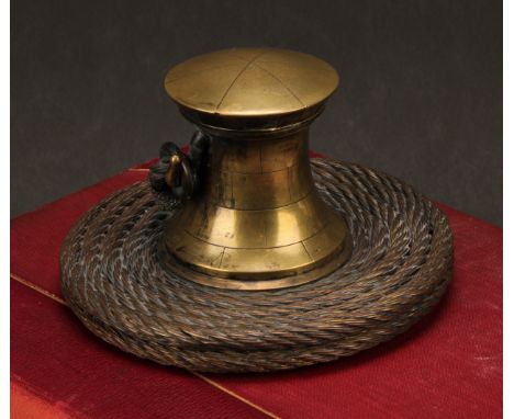 A 19th century bronze novelty inkwell, cast as a ship's capstan, the base as coiled rope, hinged cover enclosing a liner, 16c