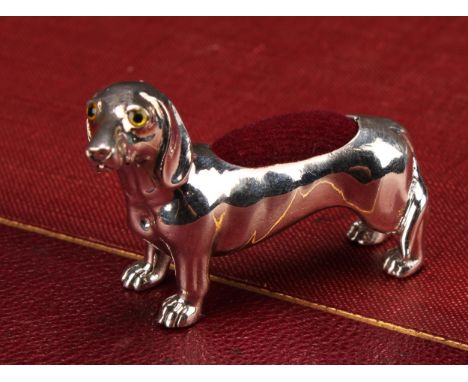 A silver novelty pin cushion, as a dachshund, marked 925 STERLING, 4.5cm long 