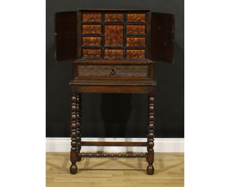An Arts &amp; Crafts period oak and marquetry connoisseur’s vargueno or contador cabinet on stand, in the 17th century taste,