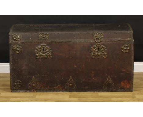 A large 19th century brass and studded leather mounted country house travel trunk or chest, hinged top, the front applied wit