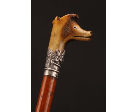 A 19th century novelty walking stick, the stag antler handle with whistle terminal carved as the head of an animal, silver co