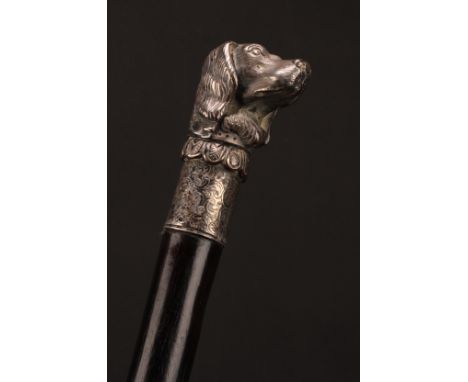 An early 20th century novelty walking stick, the silver plated pommel cast as the head of a dog, ebony cane, 89.5cm long 