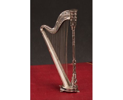 A Continental cast silver miniature model, of a harp, 15.5cm high, import marks for London 1990, 114g 