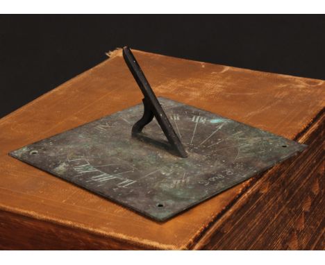 A brass sundial, Roman numerals, pierced gnomon, 15.5cm wide, 19th/early 20th century 