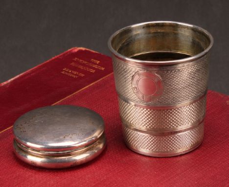 A George V silver circular snuff box and cover, 6cm, Birmingham 1911, 31g; a silver plated folding hunting beaker, engine tur
