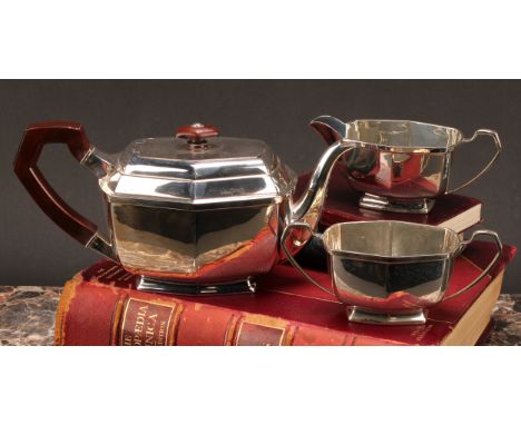 A George VI silver three piece tea service, comprising teapot, cream jug and sugar basin, Charles S Green &amp; Co, Birmingha