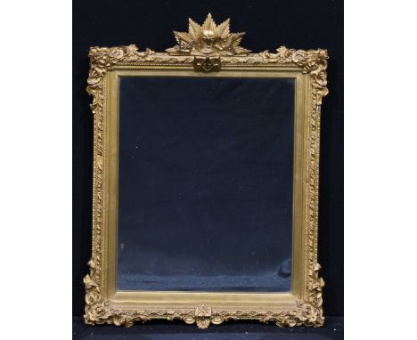 A 19th century giltwood and gesso Masonic looking glass, rectangular mirror plate, the cresting and apron modelled with globe