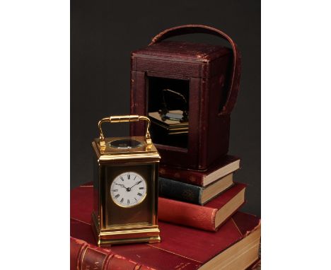 An early 20th century lacquered brass repeater carriage clock, 5cm dial inscribed with Roman and subsidiary Arabic numerals, 
