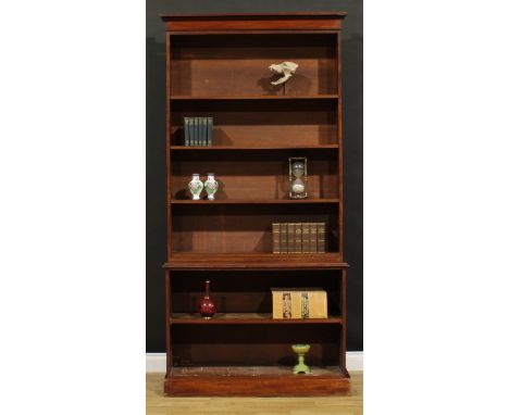 A Victorian mahogany open library bookcase, moulded cornice above an arrangement of adjustable shelves, the projecting base w