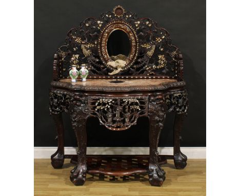 A substantial Vietnamese hardwood and mother-of-pearl marquetry pier table, shaped three-quarter gallery carved with phượng h