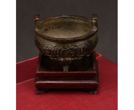 A Chinese bronze ding tripod censer, for the Islamic market, cast with Arabic calligraphy, verse from the Quran, elphant feet