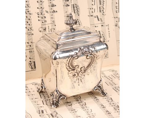 A Victorian silver rectangular bombe shaped tea caddy, of George II design, leafy knop finial, cartouche shaped scroll feet, 