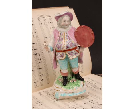 A Derby patch mark figure, Quinn as Sir John Falstaff, he stands holding an oval shield, wearing a broad brimmed hat, a doubl