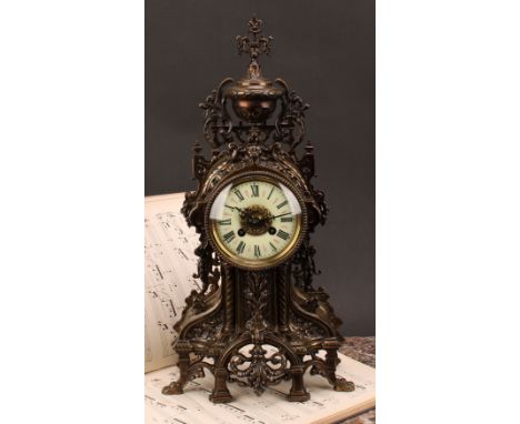 An early 20th century French brass mantel clock, 9.5cm circular dial inscribed with Roman numerals, twin winding holes, eight
