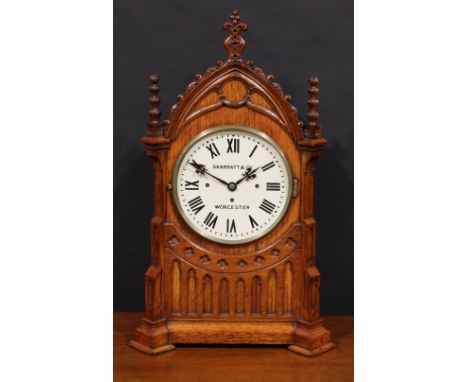 A large late Victorian Gothic Revival architectural wimperg shaped mantel clock, 24.5cm dial inscribed SKARRATT &amp; CO WORC