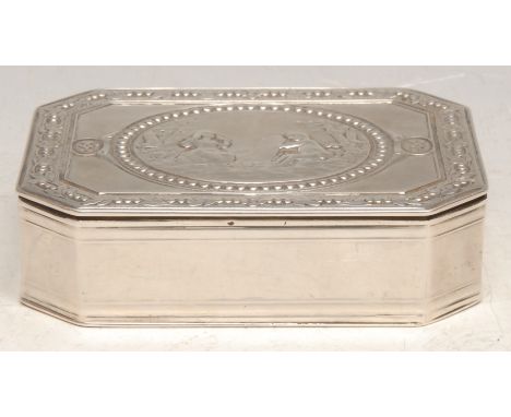 A Continental silver canted rectangular table snuff box, hinged cover, chased in the neoclassical taste, with putti and a mir