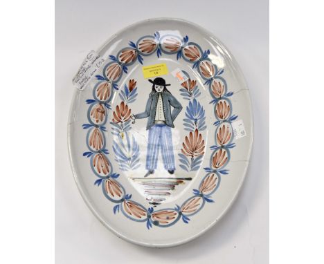 An early to mid 19th Century Quimper Breton decor platter measuring 34x25 cms, unmarked early staple repair