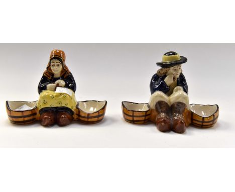 Two H.B. Quimper 19th Century salts.one of seated man, one of seated woman.