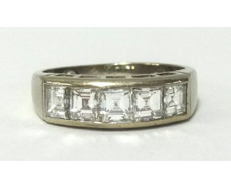 An 18ct white gold and diamond set five stone ring, the square cut diamonds weighing approx 1.36cts, finger size I/J.