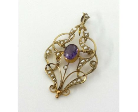 An antique 9ct gold amethyst and seed pearl pendant of Art Nouveau design approx 4.1gms.