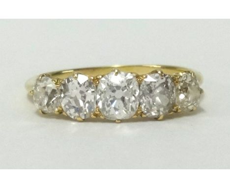 An 18ct gold diamond 5 stone ring set with graduated old cut diamonds, gross weight approx 1.40ct, finger size R.