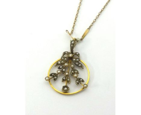 A 9ct gold and seed pearl necklace of flower spray design on a fine chain approx 4.5gms.