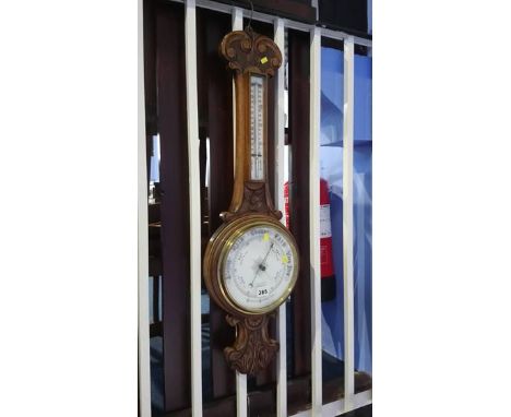 A carved oak barometer J.E Burliston, of Sunderland