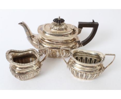 Edwardian composite three piece silver tea set - comprising teapot of compressed baluster form, with raised fluted decoration