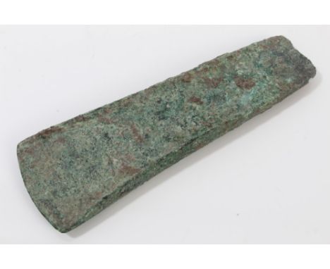 Early Bronze Age axe head, circa 1000BC, of tapered section with convex cutting edge - green patination, 10.5cm