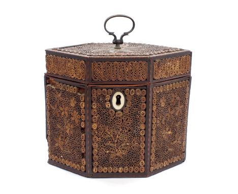 George III rolled paper tea caddy of navette outline, the hinged cover with surmounting swing handle, with oval escutcheon, 1