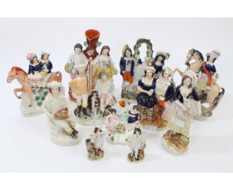 Collection of eleven Victorian Staffordshire figures - including 'Going to Market' and figures with clock face, etc 