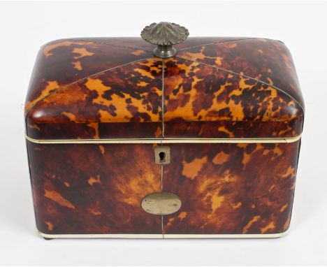 Good George IV blond tortoiseshell tea caddy of domed rectangular outline, with white metal mounts and leaf-moulded finial, t