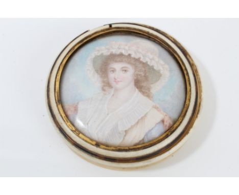 18th century ivory circular snuff box, the glazed cover housing a finely painted portrait miniature watercolour of a young wo