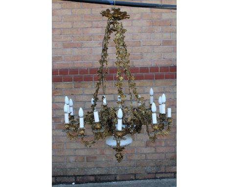 Impressive 19th century French fifteen-light gilt metal and milk glass chandelier, glass corona with gilt ornament and centra